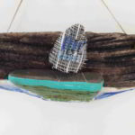 scultura raffigurante una barca a vela su legno marino